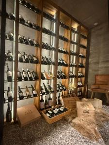 a room with a bunch of bottles of wine at Finca Boutique Un Buen Año in Tres Esquinas