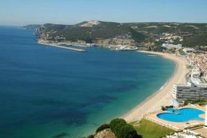 an aerial view of a beach and the ocean at Don Sebastiao in Sesimbra