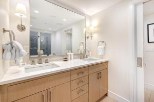a bathroom with a sink and a large mirror at Abode at Sky Silver in Park City +22 photos