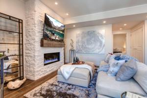 a living room with a couch and a fireplace at Abode at Sky Silver Edge in Park City