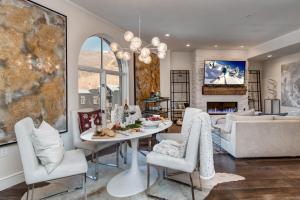 a dining room and living room with a table and chairs at Abode at Sky Silver Edge in Park City