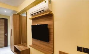 a room with a flat screen tv on a wall at Hotel Dream Patna in Patna