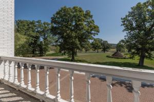 a balcony with a view of a park at The Herrington by Railey Vacations in Oakland +35 photos