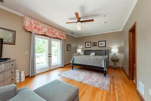 a bedroom with a bed and a ceiling fan at The Herrington by Railey Vacations in Oakland