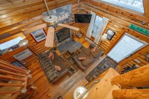 an overhead view of a living room in a log cabin at The Grizzly Den by Railey Vacations in Oakland