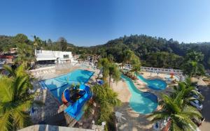 an aerial view of a pool at a resort at Pousada Camping Quedasdagua in Barra do Rio Abaixo