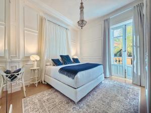 a bedroom with a bed and a large window at VILLA MARRONE - Relais - in Marsala