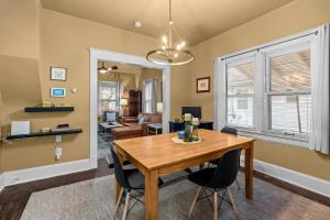 a dining room with a wooden table and chairs at Quiet 2BR Near Mercy Dog Friendly, Week & MO Rates in Springfield