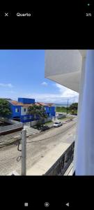 a view of a city from a window of a building at Suíte 25 vista para o mar in Pontal do Paraná