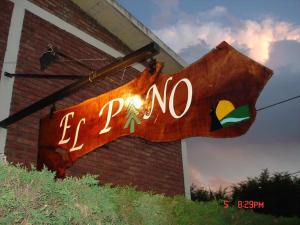 a sign on the side of a building that says ez zone at El Pino Departamentos in Villa Cura Brochero +1 photo