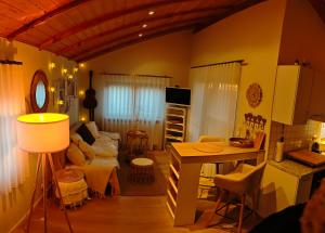 a living room with a couch and a table at Linnis Strandhaus in Garrel