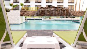 a view of a swimming pool in a hotel at South Country Suites in Mesa