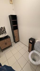 a bathroom with a sink and a toilet in a room at Maison a côté de Disney in Chessy