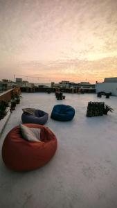 a group of three bean bags sitting on the ground at Bedcoin Hostel in Hurghada