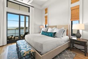a bedroom with a bed and a large window at 283 Lakeview Drive in Seagrove Beach