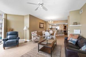 a living room with a couch and chairs and a table at Jade East Towers 0740 in Destin