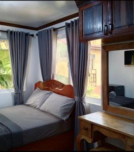 a bedroom with a bed and a window with curtains at Noah Bed&Breakfast 3 Private Room NEWHOME Quiet Place to Stay 14 Minutes to PPS Airport in Puerto Princesa City +81 photos