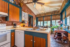 a kitchen with a sink and a counter top at Terrace Carriage House in Natchez +22 photos