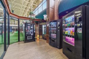 a room with several vending machines in a building at Stayable Jax West in Jacksonville