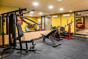 a gym with several exercise bikes in a room at Hotel Sercotel Plana Onda in Onda