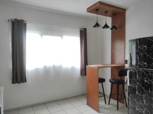 a kitchen with a refrigerator and a table in it at Departamento Privado in Guadalajara