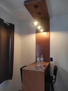 two bottles of water sitting on top of a table at Departamento Privado in Guadalajara