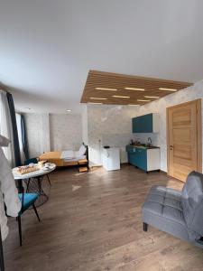a living room with a couch and a table at Apart-Hotel Seti in Mestia