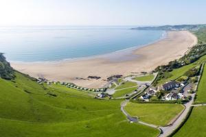 an aerial view of a beach with houses at 3 Bed in Putsborough oc-flat11 in Croyde