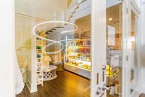 a room with a staircase and a door with a glass door at Beach Club 806A by Youngs Suncoast in Gulf Highlands