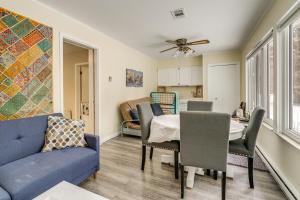 a living room with a blue couch and a table at Woodsy & Charming! Applegate Cabin w/ Large Yard in Applegate