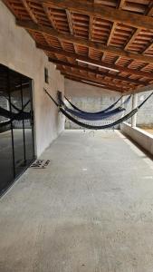 a patio with a hammock in a building at CasAnita in Cavalcante