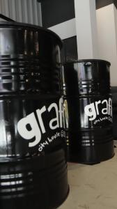 two large black buckets sitting on a table at Graffi City House in Florianópolis