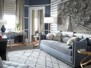 a living room with a couch and a table at Pandora's Manor in High Point