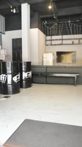 a room with three black trash cans and a counter at Graffi City House in Florianópolis +18 photos