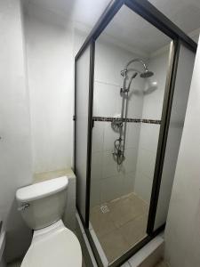 a bathroom with a shower and a toilet at Éclat Hotel Boutique in Iquique +17 photos