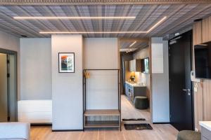 a living room with a hallway with a kitchen at Gerlach in Zakopane