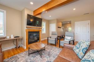 a living room with a couch and a fireplace at Apres Ski by Railey Vacations in McHenry