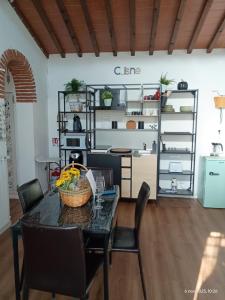 a dining room with a table and chairs at Fienile Paradiso Home Tuscany in Campi Bisenzio