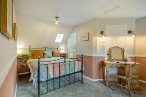 a bedroom with a bed and a mirror at 2 Bed in Wickhampton oc-t34449 in Wickhampton