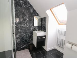 a bathroom with a sink and a shower at Sealladh in Appin +15 photos