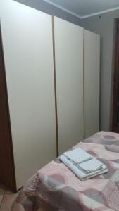 a bedroom with a bed with a book on it at Casa Castel San Giovanni in Castel San Giovanni
