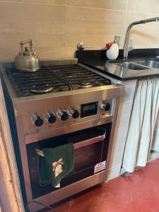 an oven with a pot sitting on top of it at Villa Paula in Ranchos
