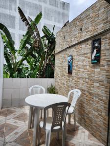 a white table and chairs on a patio at Hotel Marajoara in Belém