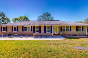 a home with a yellow and blue house at Danielsville Home on Sprawling Acreage w/ Views! in Commerce