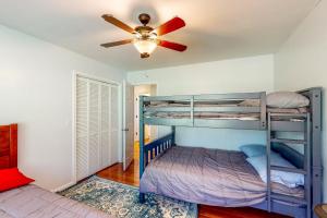 a bedroom with two bunk beds and a ceiling fan at Danielsville Home on Sprawling Acreage w/ Views! in Commerce