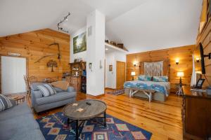 a living room with a couch and a bed at The Treehouse at the Rustic Retreat in Nashville