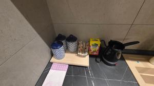 a table with two coffee makers and a blender at Apartman Nadja in Šabac