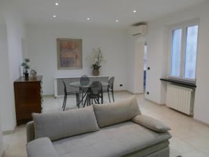 a living room with a couch and a table at Andrea Appartamenti in Savona