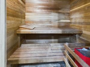a wooden sauna with a bench in the middle at Oceanfront Apartment with Sauna and Covered Deck in Juneau
