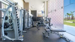 a row of tread machines in a gym at Luxury Oceanfront Condo with Stunning Views in Puerto Peñasco